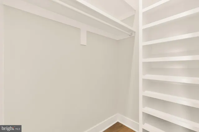 a view of a balcony with floor to ceiling windows