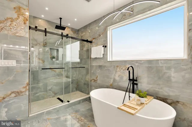 a bathroom with a bathtub and shower