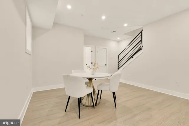 a living room with furniture and a night stand