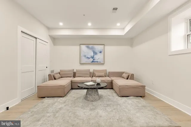 a living room with furniture and a table