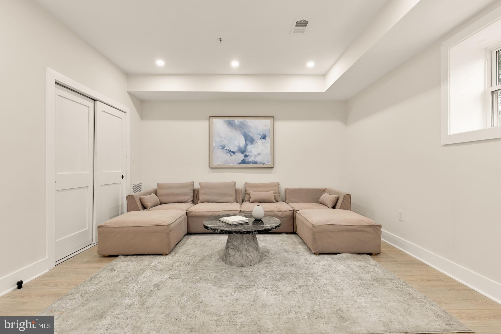1631 G Street Southeast Washington, DC 20003 - Photo 36 of 42 a living room with furniture and a night stand