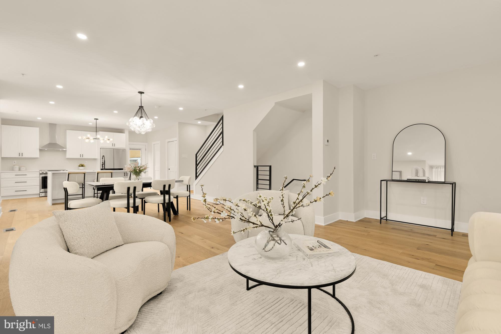 1631 G Street Southeast Washington, DC 20003 - Photo 8 of 42 a living room with furniture a table and kitchen view