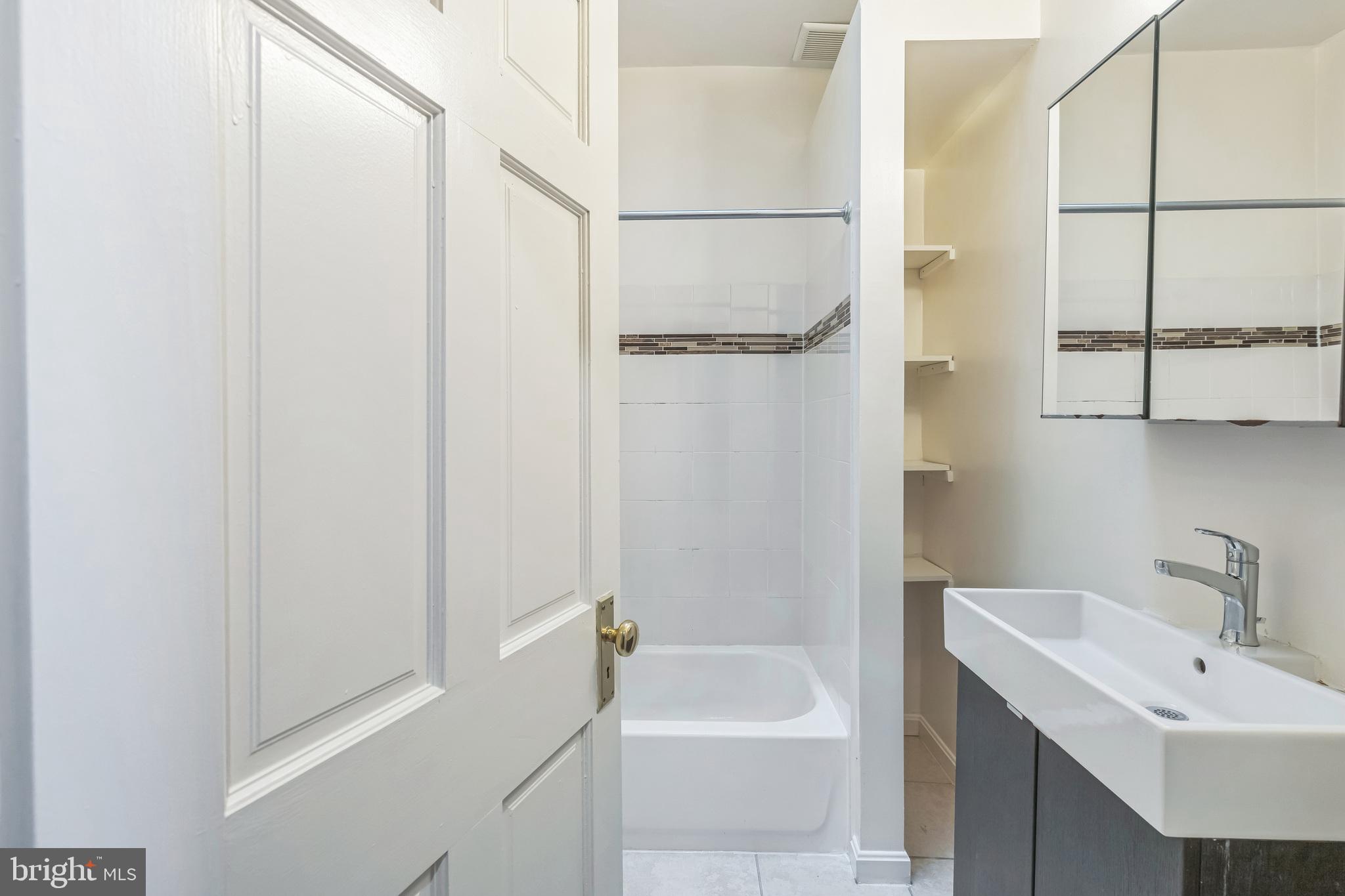 522 Randolph Street Northwest, Unit 1 Washington, DC 20011 - Photo 11 of 33 a bathroom with a sink a toilet and shower