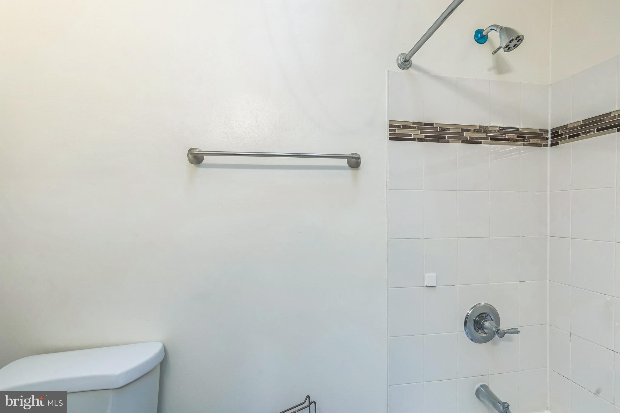 522 Randolph Street Northwest, Unit 1 Washington, DC 20011 - Photo 12 of 33 a bathroom with a shower and a toilet