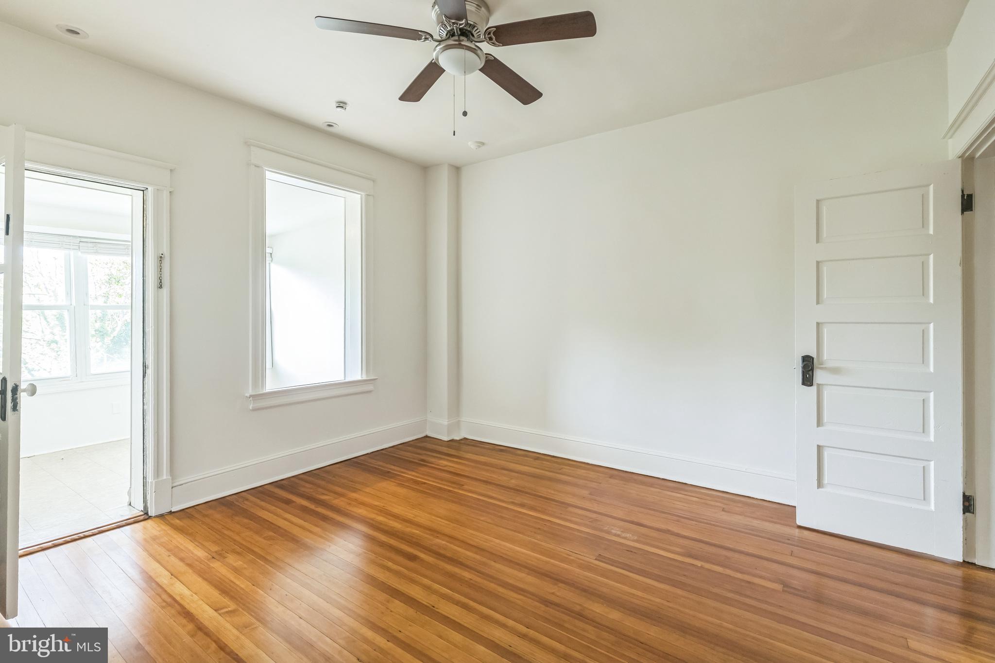 522 Randolph Street Northwest, Unit 1 Washington, DC 20011 - Photo 20 of 33 a view of empty room with wooden floor and fan