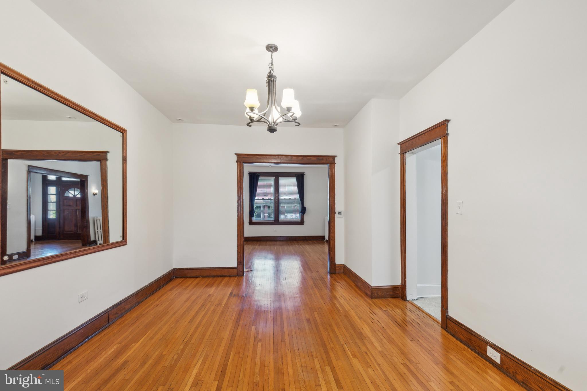 522 Randolph Street Northwest, Unit 1 Washington, DC 20011 - Photo 2 of 33 a view of a room with wooden floor staircase and a kitchen