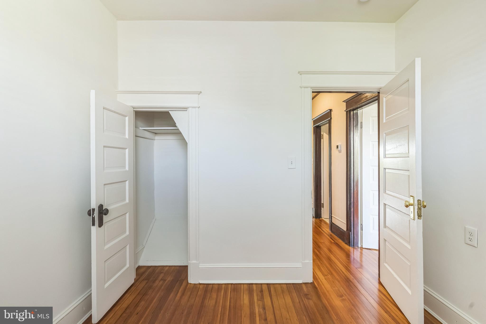 522 Randolph Street Northwest, Unit 1 Washington, DC 20011 - Photo 32 of 33 a view of a hallway with wooden floor and closet