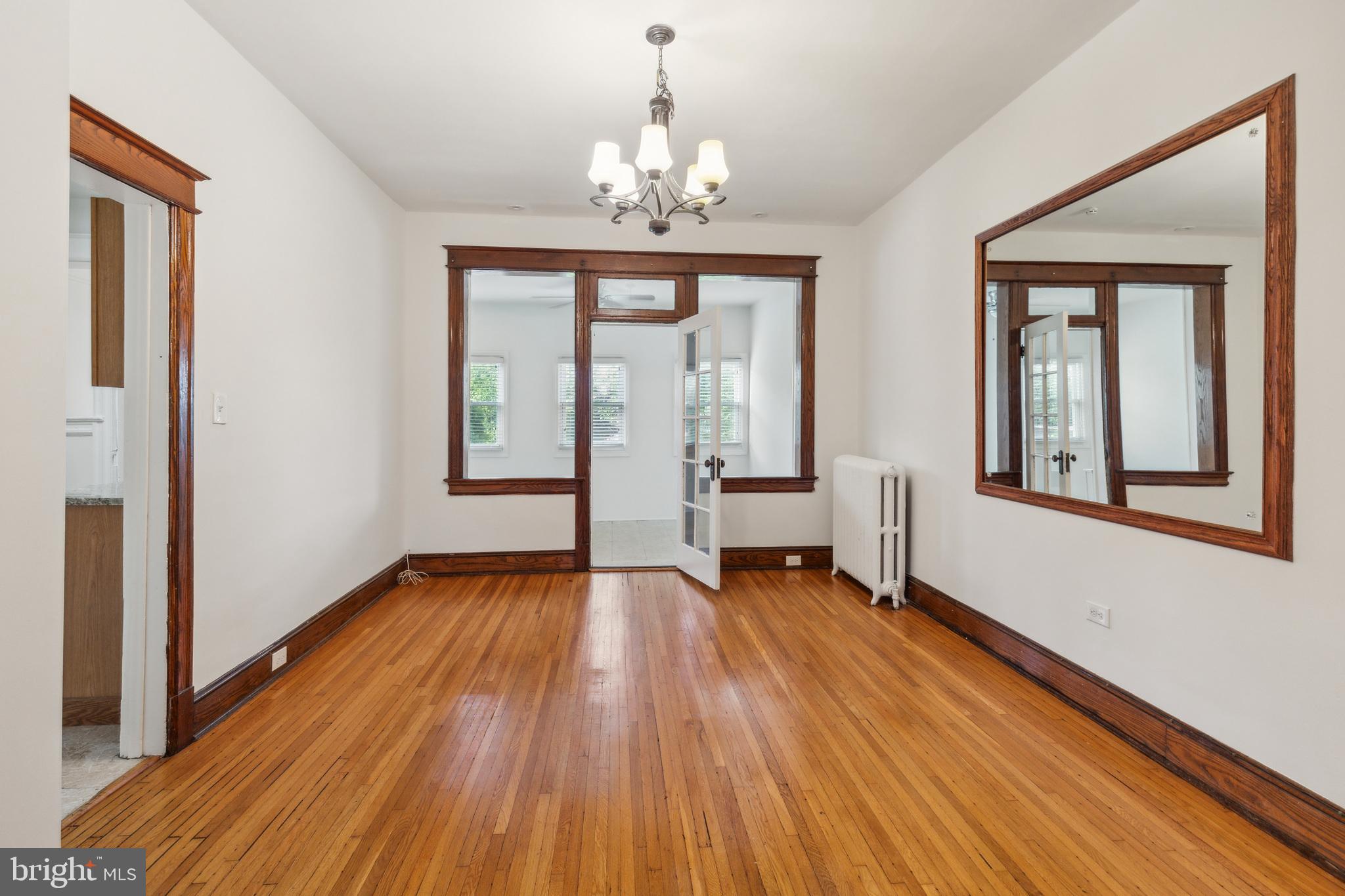522 Randolph Street Northwest, Unit 1 Washington, DC 20011 - Photo 33 of 33 a view of an empty room with wooden floor and a window