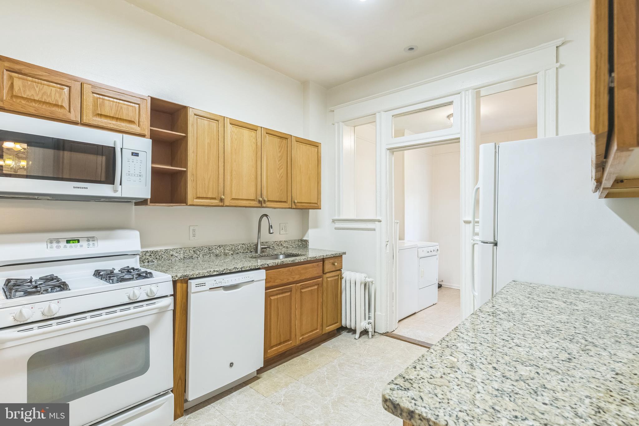 522 Randolph Street Northwest, Unit 1 Washington, DC 20011 - Photo 7 of 33 a kitchen with a stove microwave and cabinets