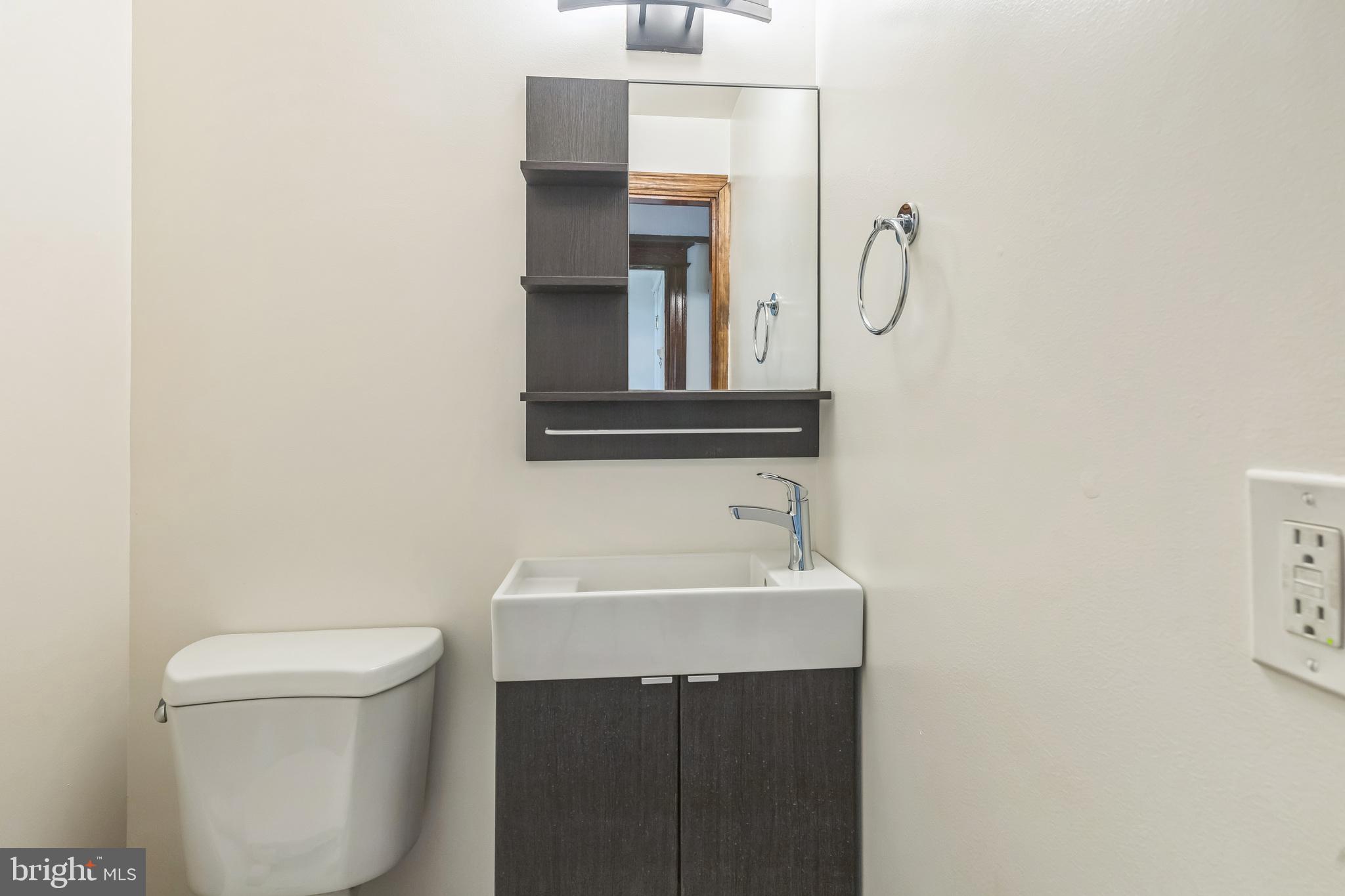 522 Randolph Street Northwest, Unit 1 Washington, DC 20011 - Photo 9 of 33 a bathroom with a sink and a toilet