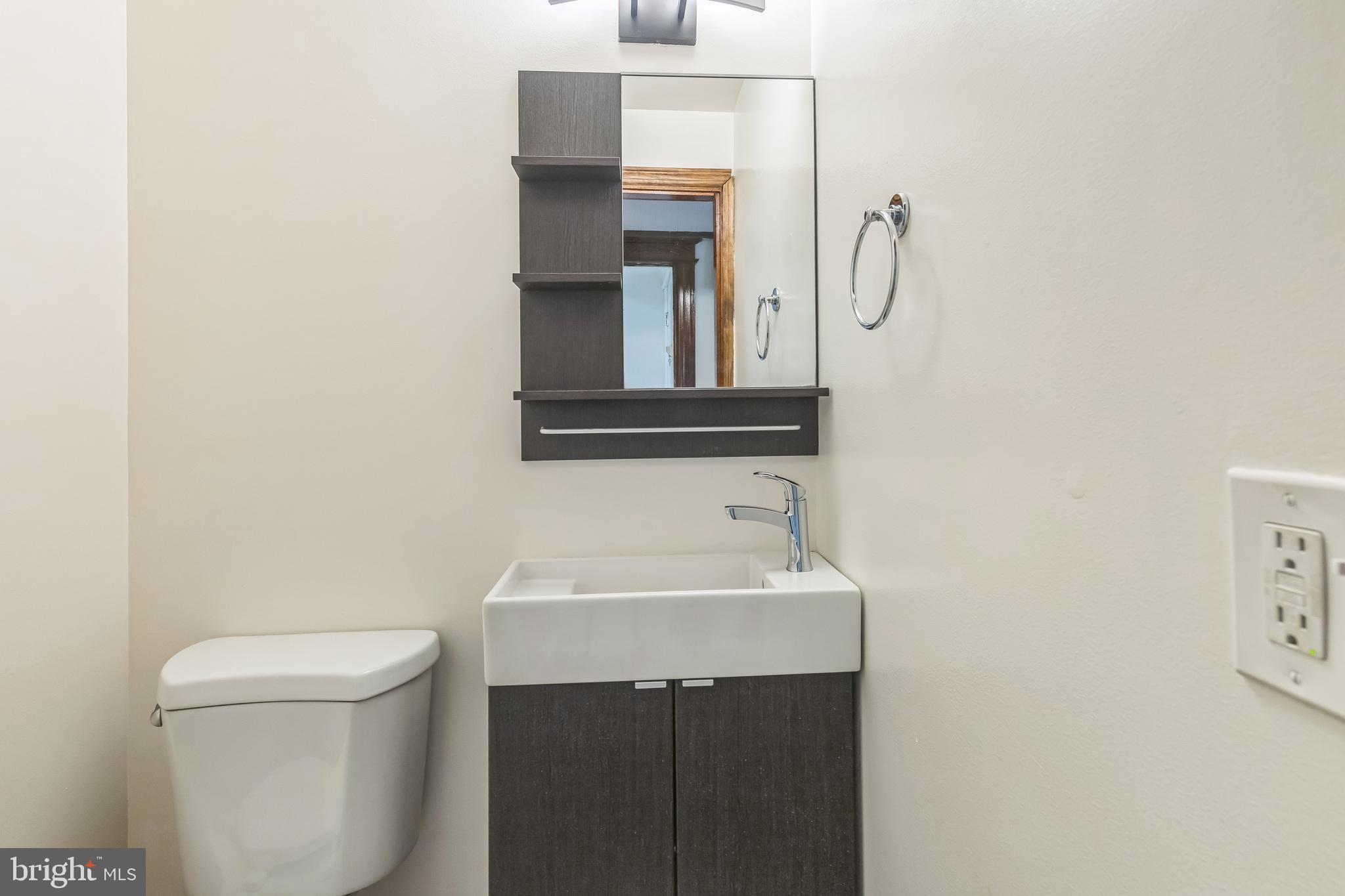 522 Randolph Street Northwest, Unit 1 Washington, DC 20011 - Photo 10 of 33 a bathroom with a sink and a toilet
