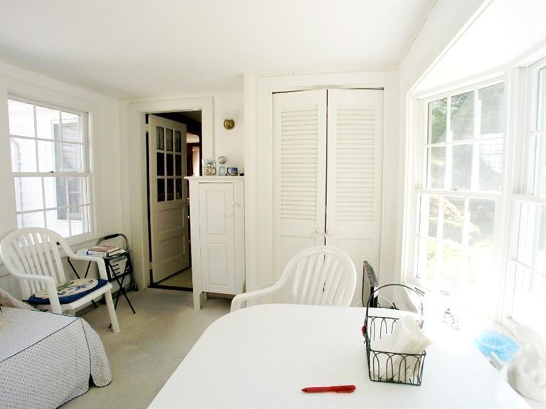 92 Earle Road West Harwich, MA 02671 - Photo 11 of 19 a bedroom with a bed and wooden floor