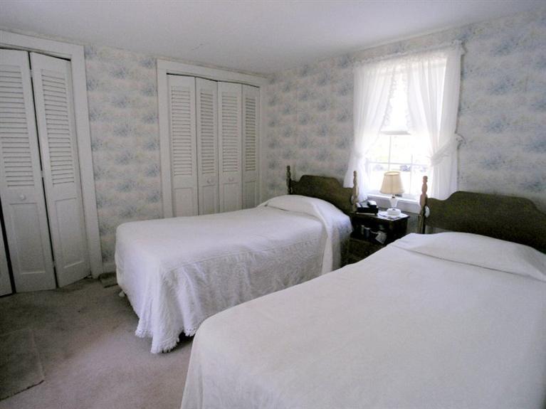 92 Earle Road West Harwich, MA 02671 - Photo 14 of 19 a bedroom with two beds and a window