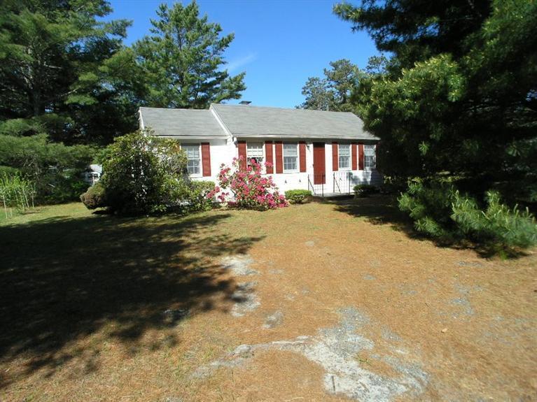 92 Earle Road West Harwich, MA 02671 - Photo 2 of 19 a front view of a house with a yard