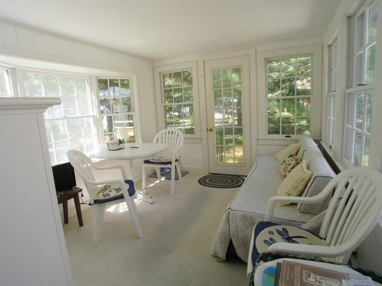 92 Earle Road West Harwich, MA 02671 - Photo 10 of 19 a living room with furniture and large windows