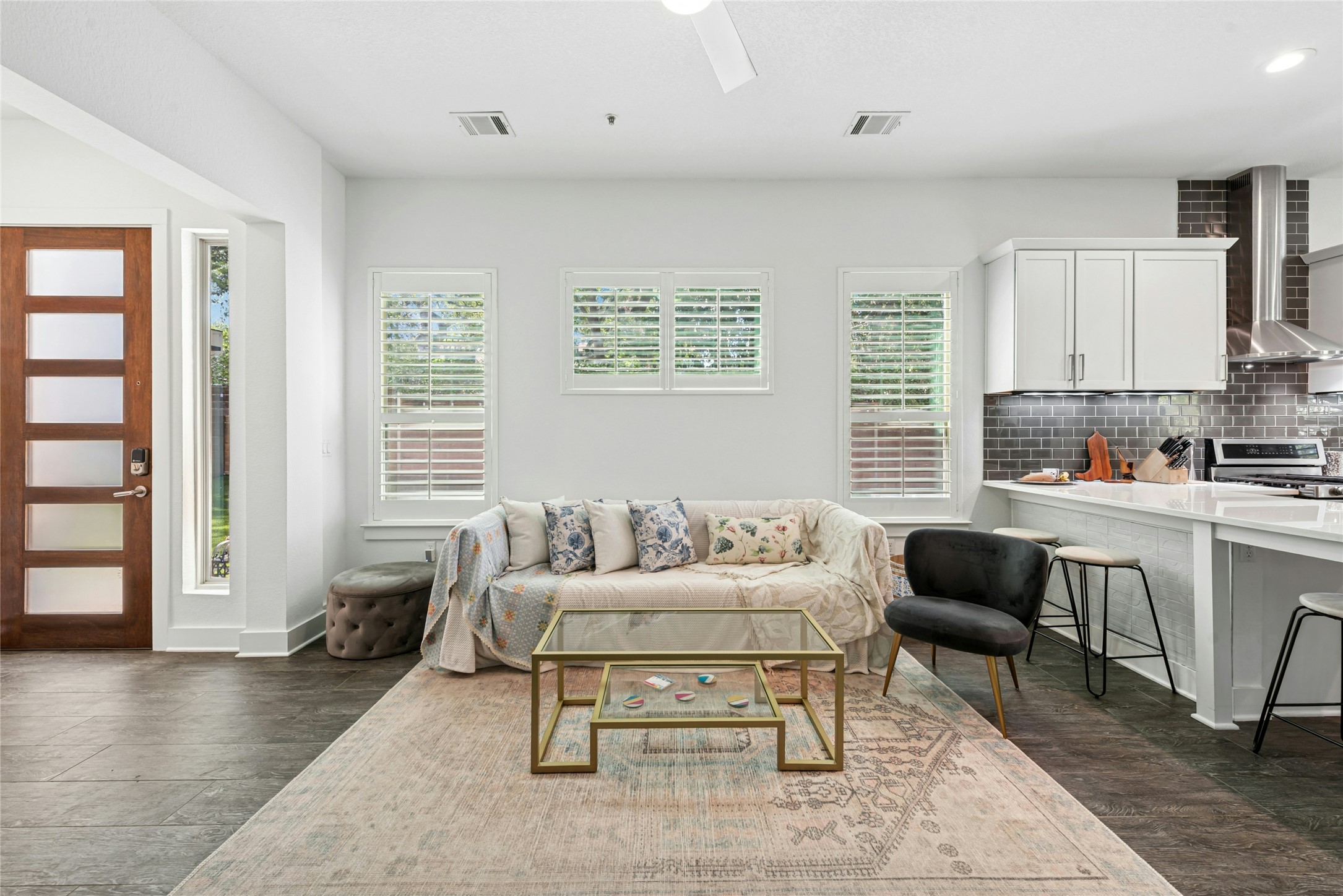 404 West Alpine Road, Unit 17 Austin, TX 78704 - Photo 16 of 35 Living area featuring dark wood-style floors and ceiling fan