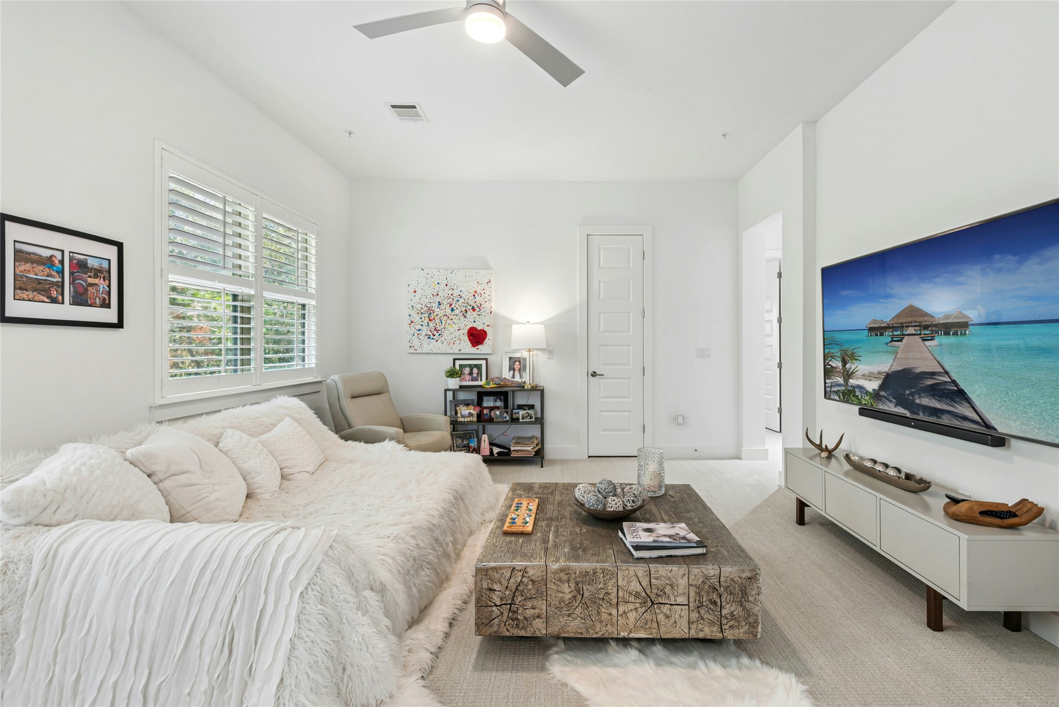 404 West Alpine Road, Unit 17 Austin, TX 78704 - Photo 22 of 35 Bedroom featuring light colored carpet and a ceiling fan