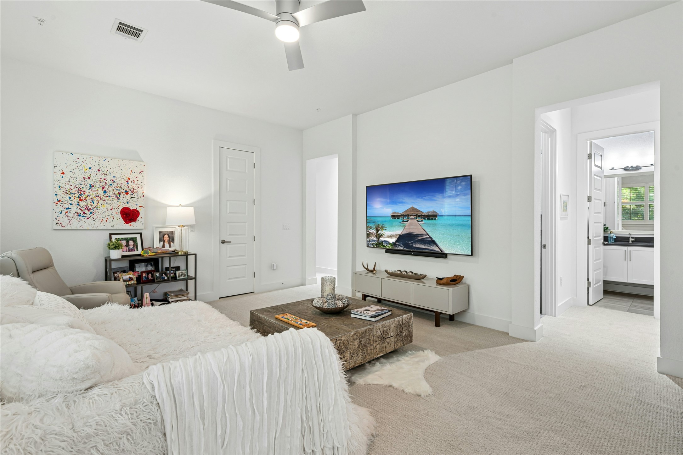404 West Alpine Road, Unit 17 Austin, TX 78704 - Photo 23 of 35 Living room featuring a ceiling fan and light carpet