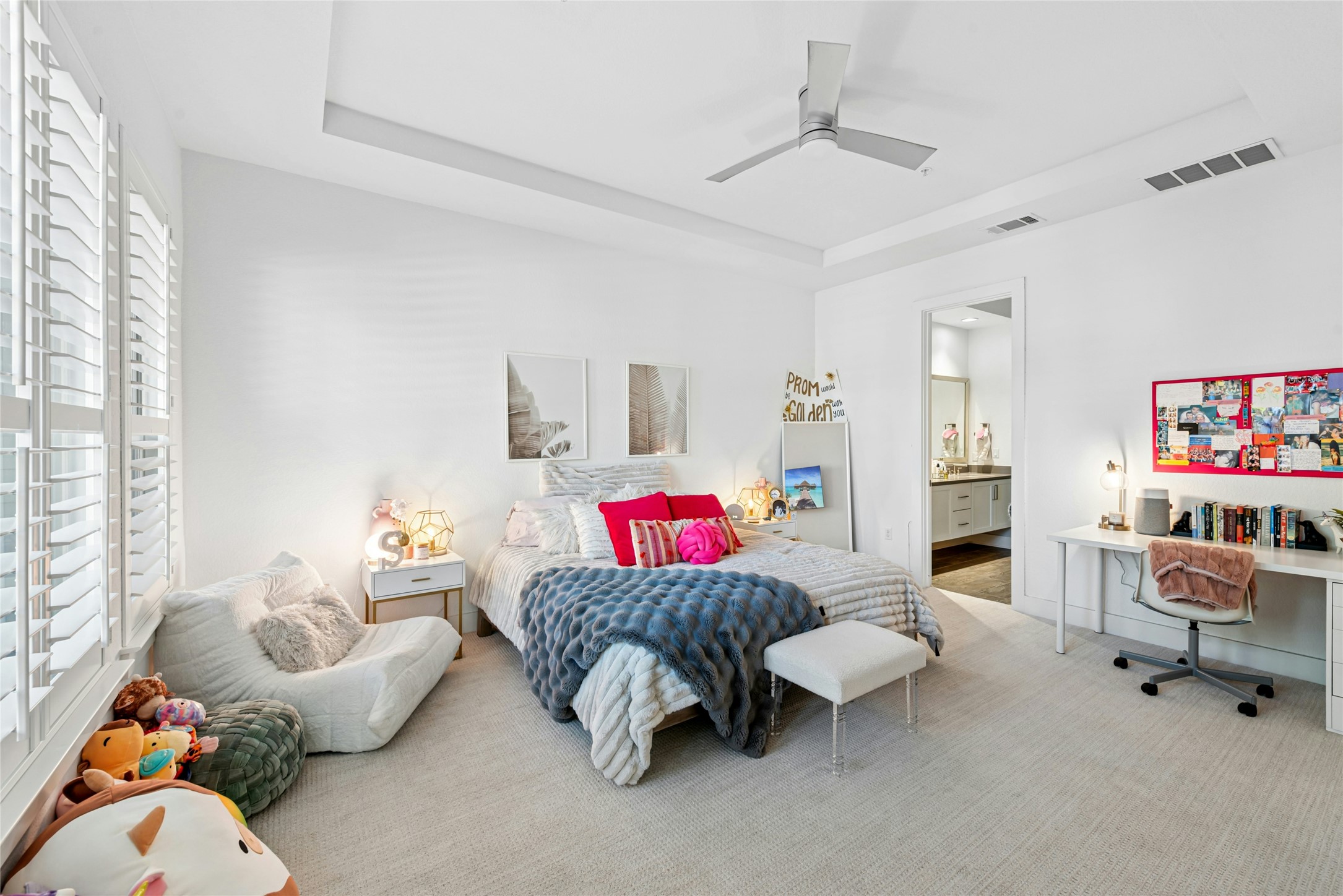 404 West Alpine Road, Unit 17 Austin, TX 78704 - Photo 31 of 35 Carpeted bedroom featuring a raised ceiling, multiple windows, an office area, a ceiling fan, and ensuite bath