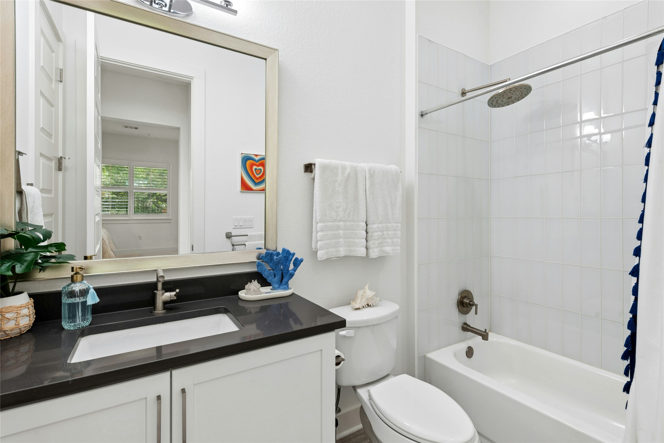 404 West Alpine Road, Unit 17 Austin, TX 78704 - Photo 33 of 35 Bathroom with vanity and shower / tub combo with curtain