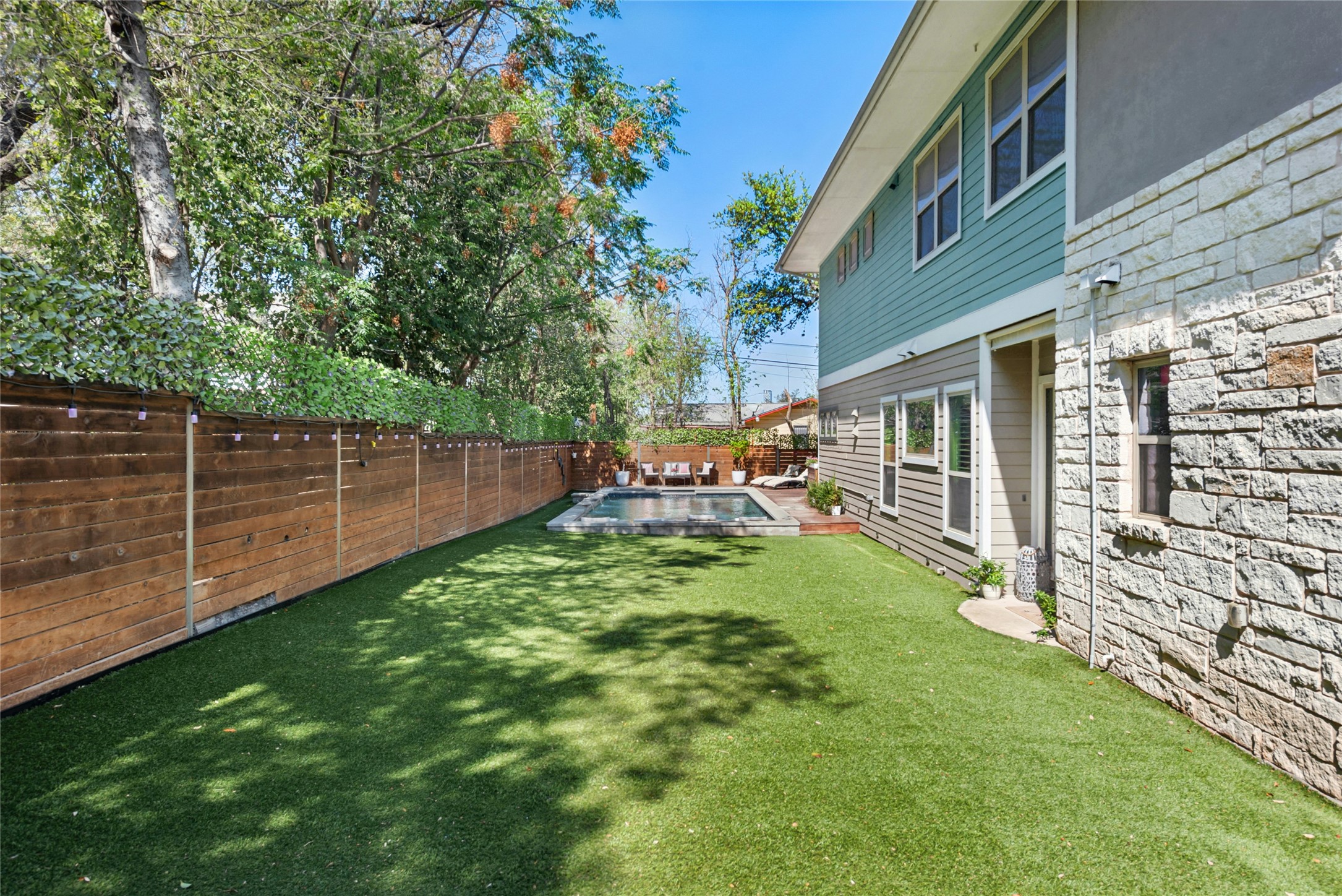 404 West Alpine Road, Unit 17 Austin, TX 78704 - Photo 8 of 35 Fenced backyard with a patio area