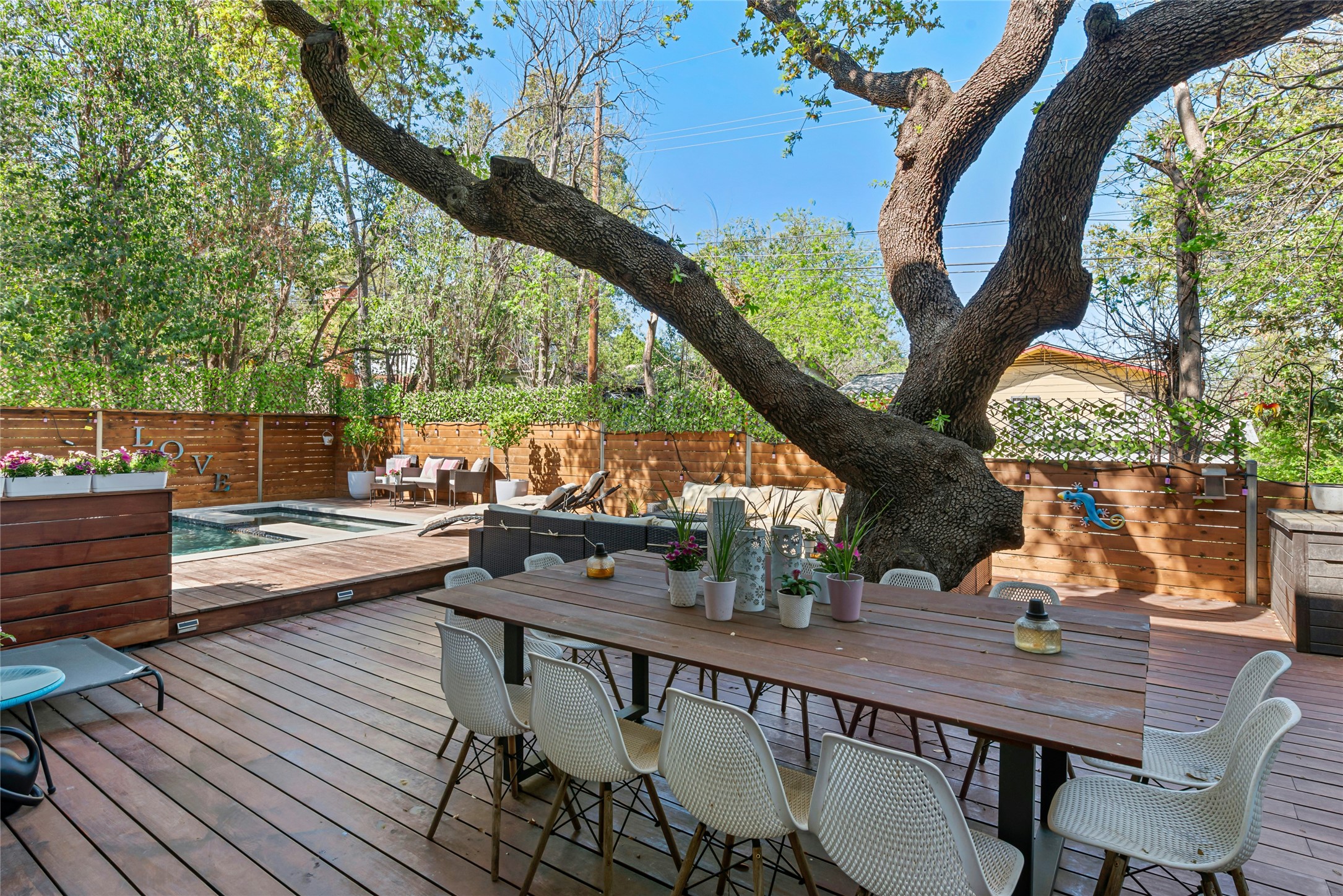 404 West Alpine Road, Unit 17 Austin, TX 78704 - Photo 9 of 35 Wooden deck with outdoor lounge area and a fenced backyard