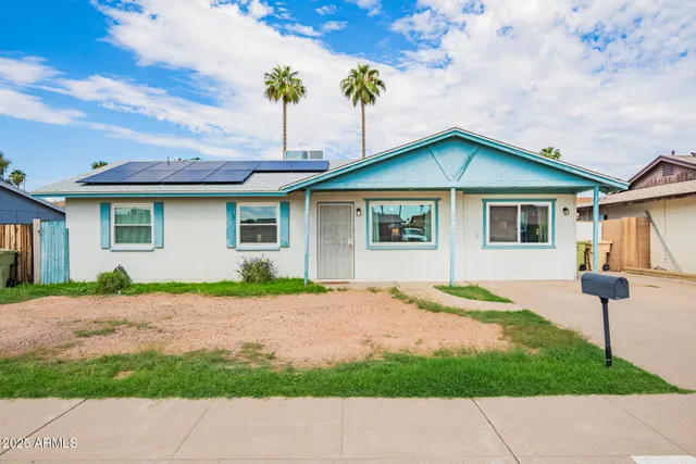 a house with yard in front of it