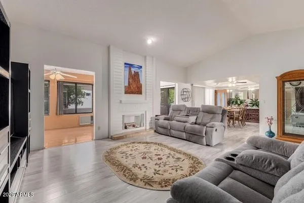 a living room with furniture and a large window
