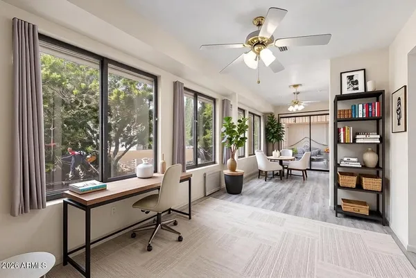 a living room with furniture and a large window