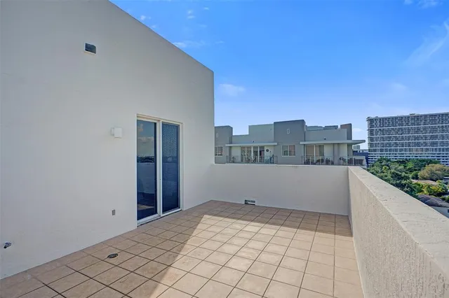 a view of an empty room and city