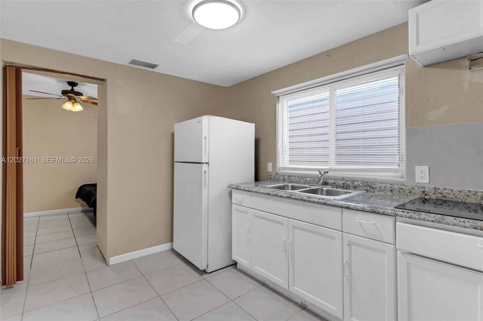 15440 Southwest 294th Terrace Homestead, FL 33033 - Photo 18 of 31 a kitchen with stainless steel appliances granite countertop a refrigerator and a sink