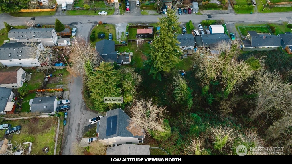 672 Lind Avenue Northwest Renton, WA 98057 - Photo 11 of 25 an aerial view of a house with a yard and lake view