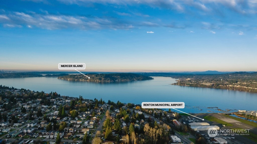 672 Lind Avenue Northwest Renton, WA 98057 - Photo 2 of 25 a view of a lake with houses