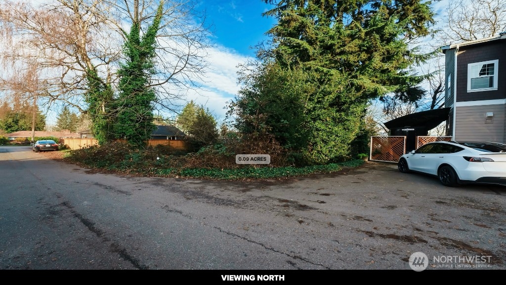 672 Lind Avenue Northwest Renton, WA 98057 - Photo 25 of 25 a view of a street with a parked cars