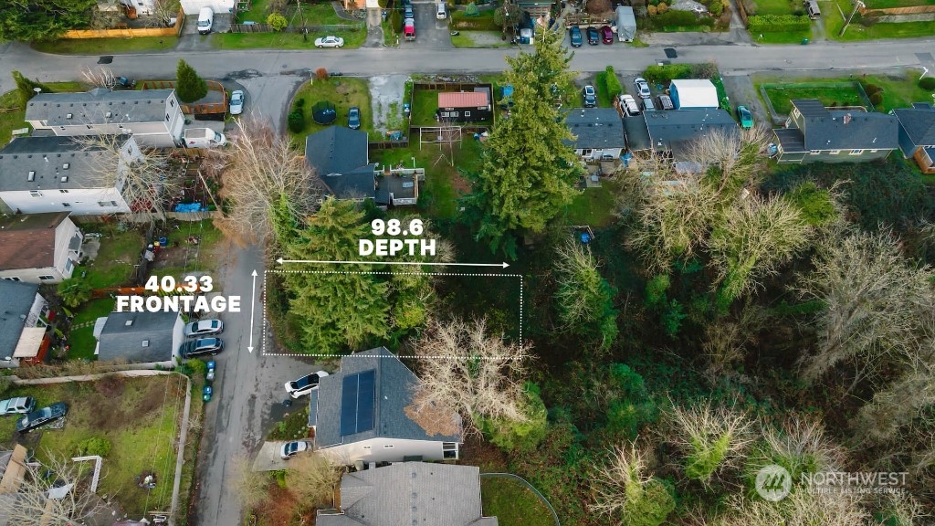 672 Lind Avenue Northwest Renton, WA 98057 - Photo 4 of 25 an aerial view of a house with a yard and garden