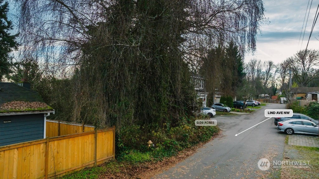 672 Lind Avenue Northwest Renton, WA 98057 - Photo 5 of 25 a view of a street with cars on road