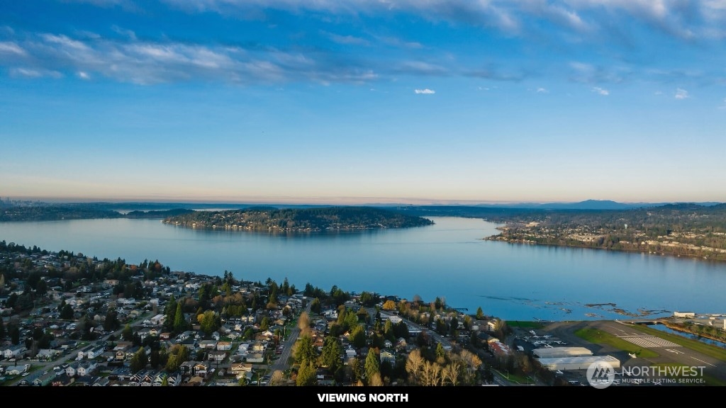 672 Lind Avenue Northwest Renton, WA 98057 - Photo 6 of 25 a view of a lake with a city