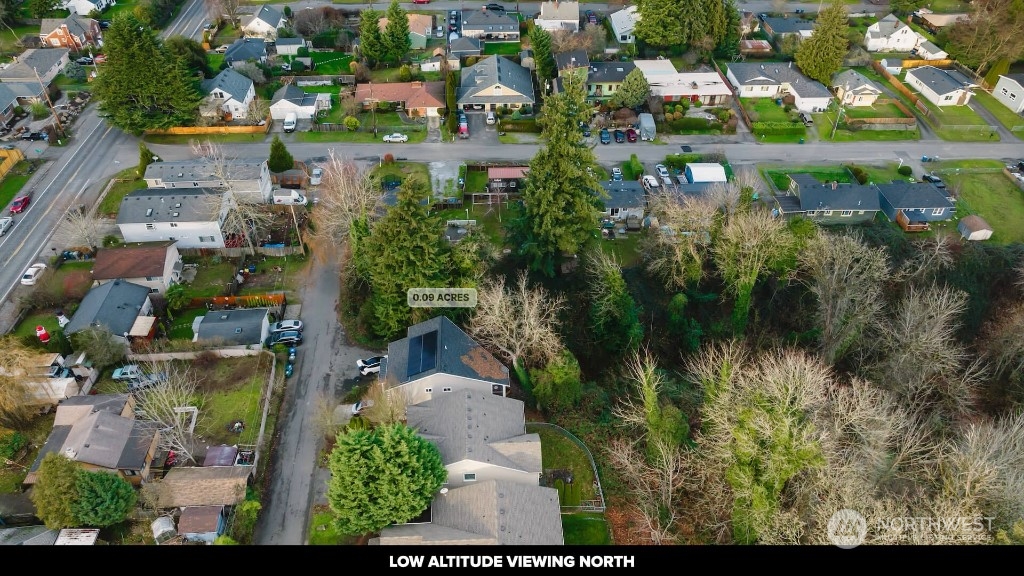 672 Lind Avenue Northwest Renton, WA 98057 - Photo 10 of 25 an aerial view of residential houses with outdoor space and swimming pool