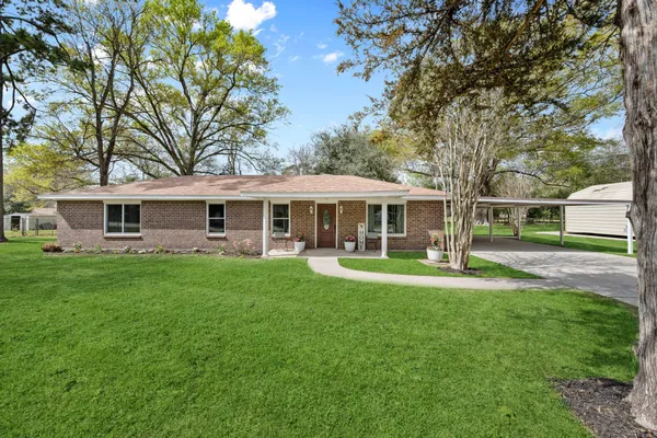 front view of a house with a garden