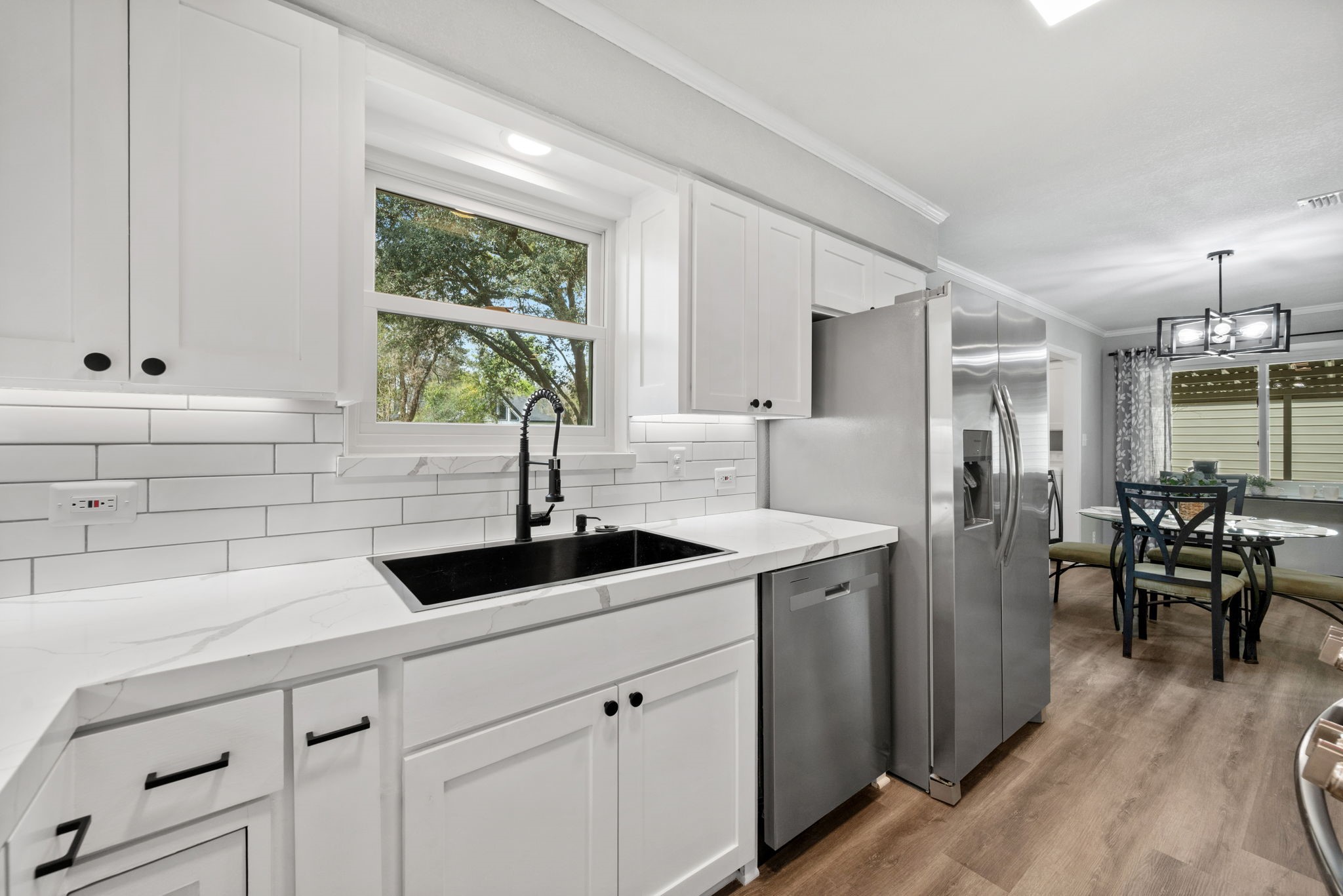 16746 Main Street Splendora, TX 77372 - Photo 14 of 24 a kitchen with a sink and cabinets
