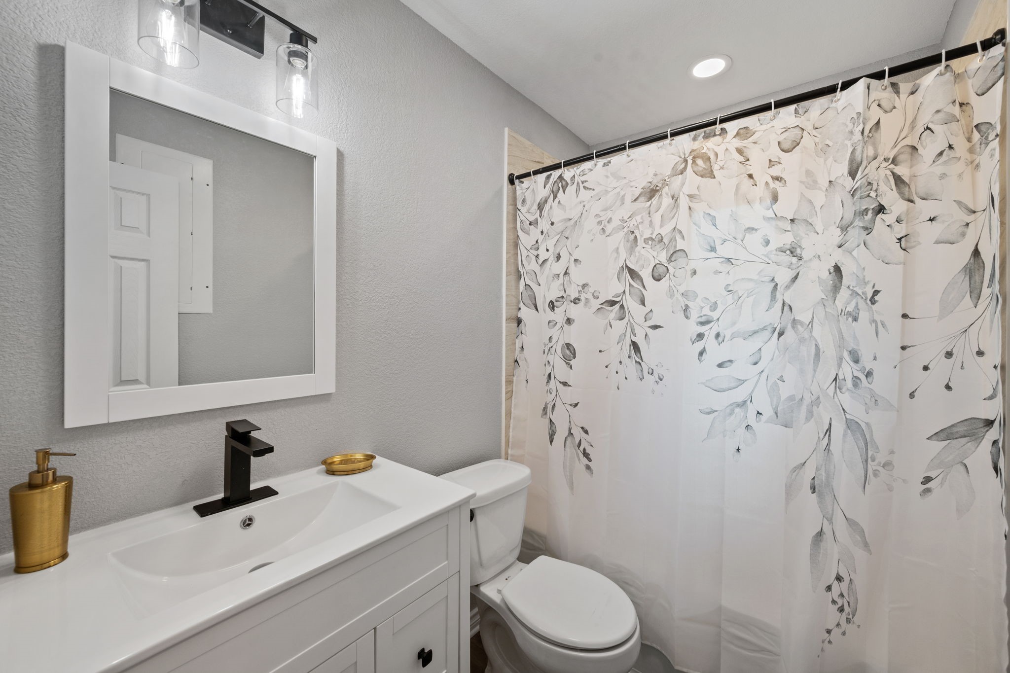 16746 Main Street Splendora, TX 77372 - Photo 17 of 24 a bathroom with a sink toilet and shower