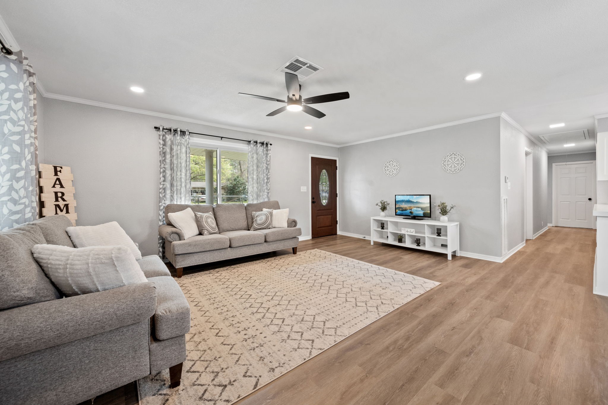 16746 Main Street Splendora, TX 77372 - Photo 4 of 24 a living room with furniture and a rug