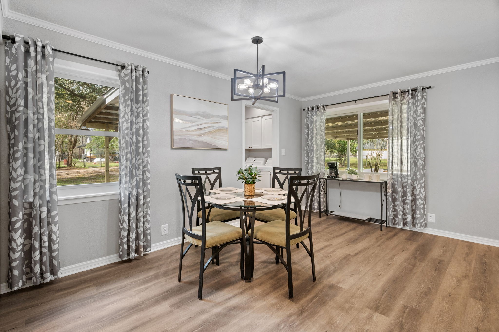 16746 Main Street Splendora, TX 77372 - Photo 5 of 24 a view of a dining room with furniture window and wooden floor