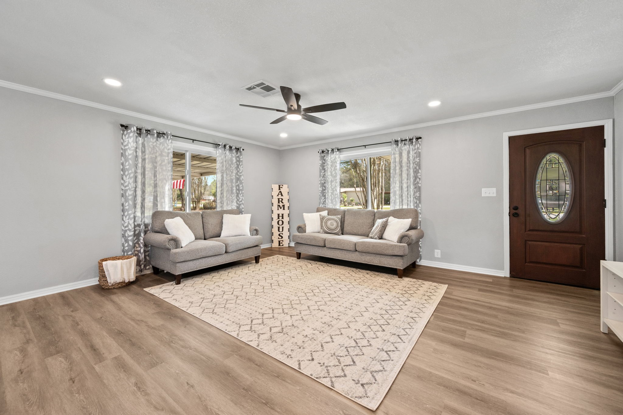 16746 Main Street Splendora, TX 77372 - Photo 10 of 24 a living room with furniture and a rug