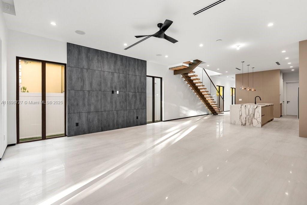 1215 Northeast 11th Avenue, Unit B Fort Lauderdale, FL 33304 - Photo 17 of 62 a view of a livingroom with a ceiling fan