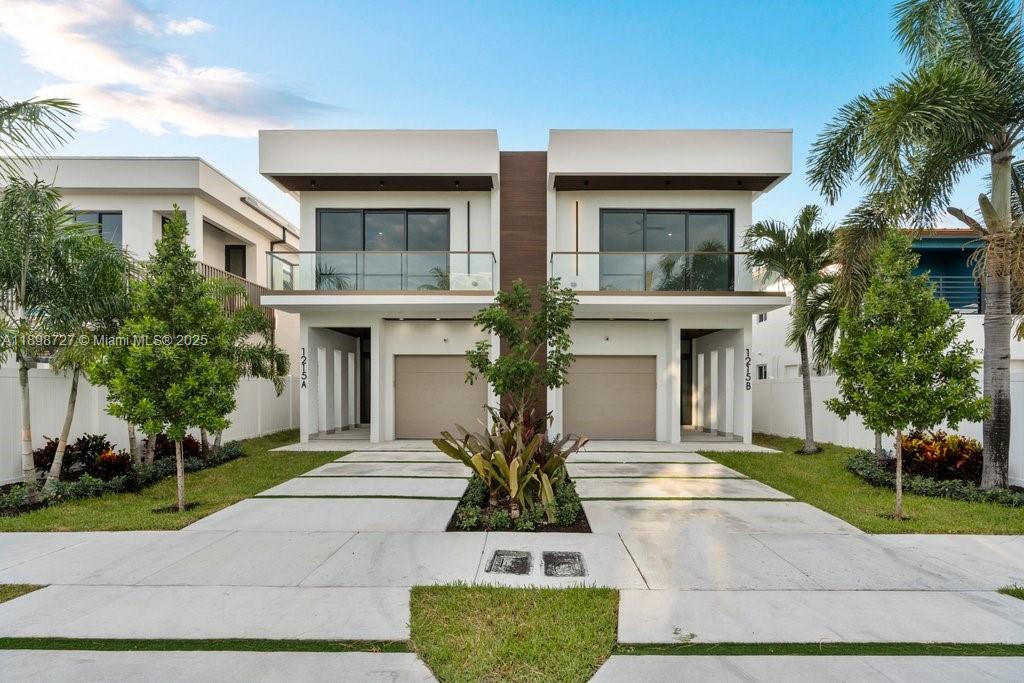 1215 Northeast 11th Avenue, Unit B Fort Lauderdale, FL 33304 - Photo 2 of 62 a view of house in front of a yard with potted plants