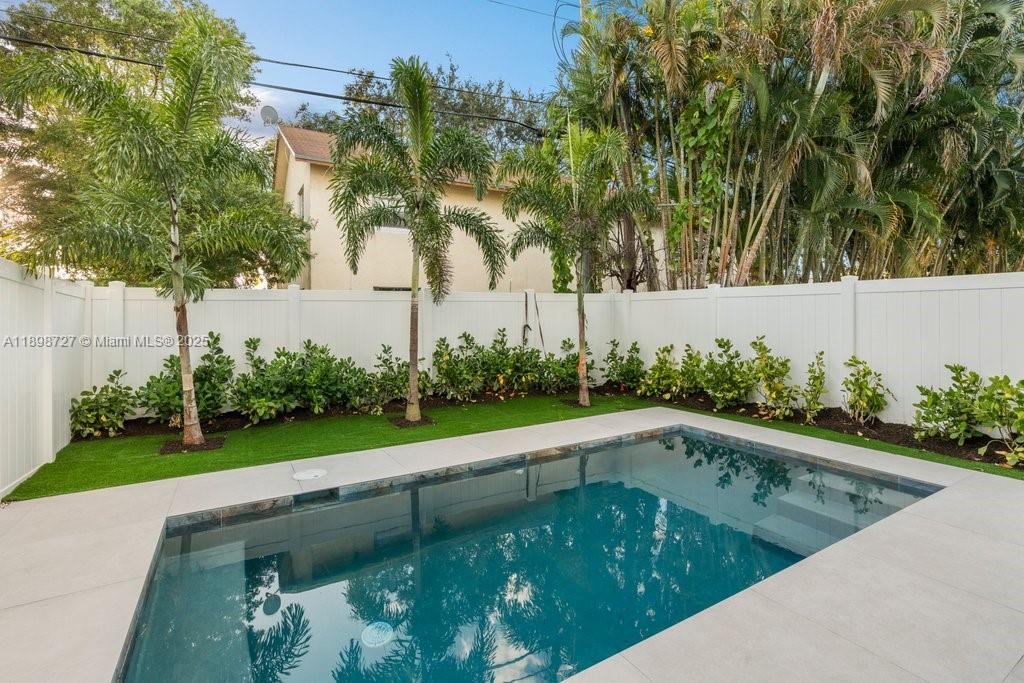 1215 Northeast 11th Avenue, Unit B Fort Lauderdale, FL 33304 - Photo 21 of 62 a view of swimming pool from a outdoor space
