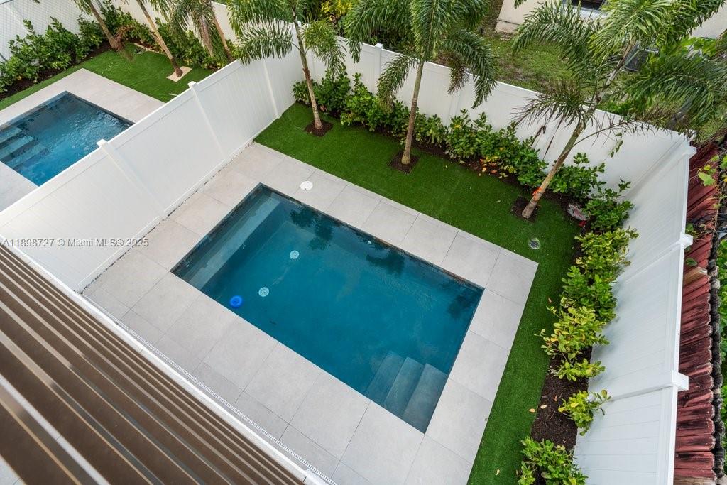 1215 Northeast 11th Avenue, Unit B Fort Lauderdale, FL 33304 - Photo 35 of 62 a view of a yard from a balcony