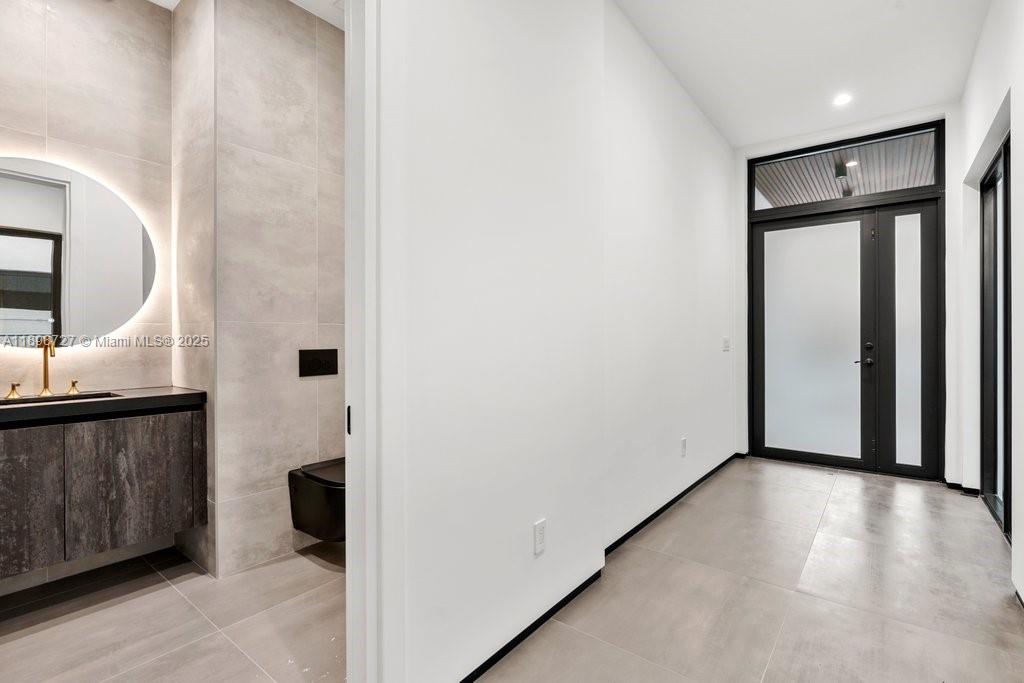 1215 Northeast 11th Avenue, Unit B Fort Lauderdale, FL 33304 - Photo 36 of 62 a view of a kitchen with a sink and a stove top oven