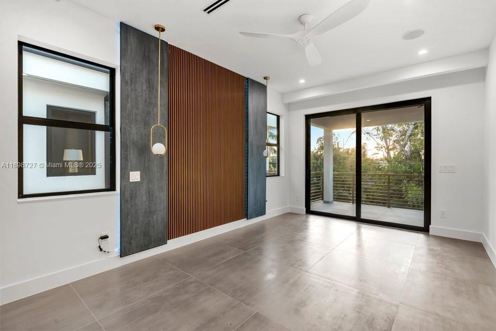 1215 Northeast 11th Avenue, Unit B Fort Lauderdale, FL 33304 - Photo 47 of 62 an empty room with windows and closet